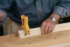 Using spring clamps to hold the frame while the glue dries